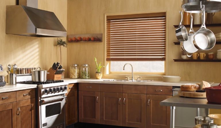 Southern California kitchen faux wood blinds.